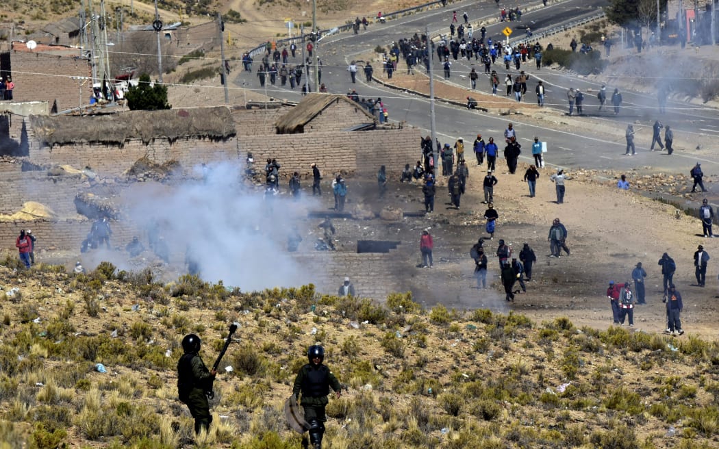 Riot policemen and miners clash in Panduro, in the La Paz district of Bolivia.