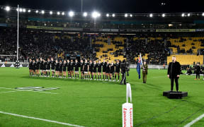 Players of New Zealand line up for the national anthems before the Rugby Championship - New Zealand All Blacks v Argentina at Sky Stadium.