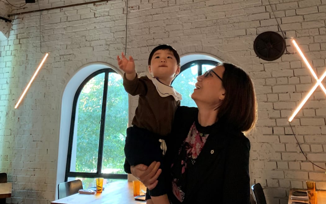 Oliver enjoys some freedom with his grandmother, Xiaofen Chen, after the lockdowns finished.