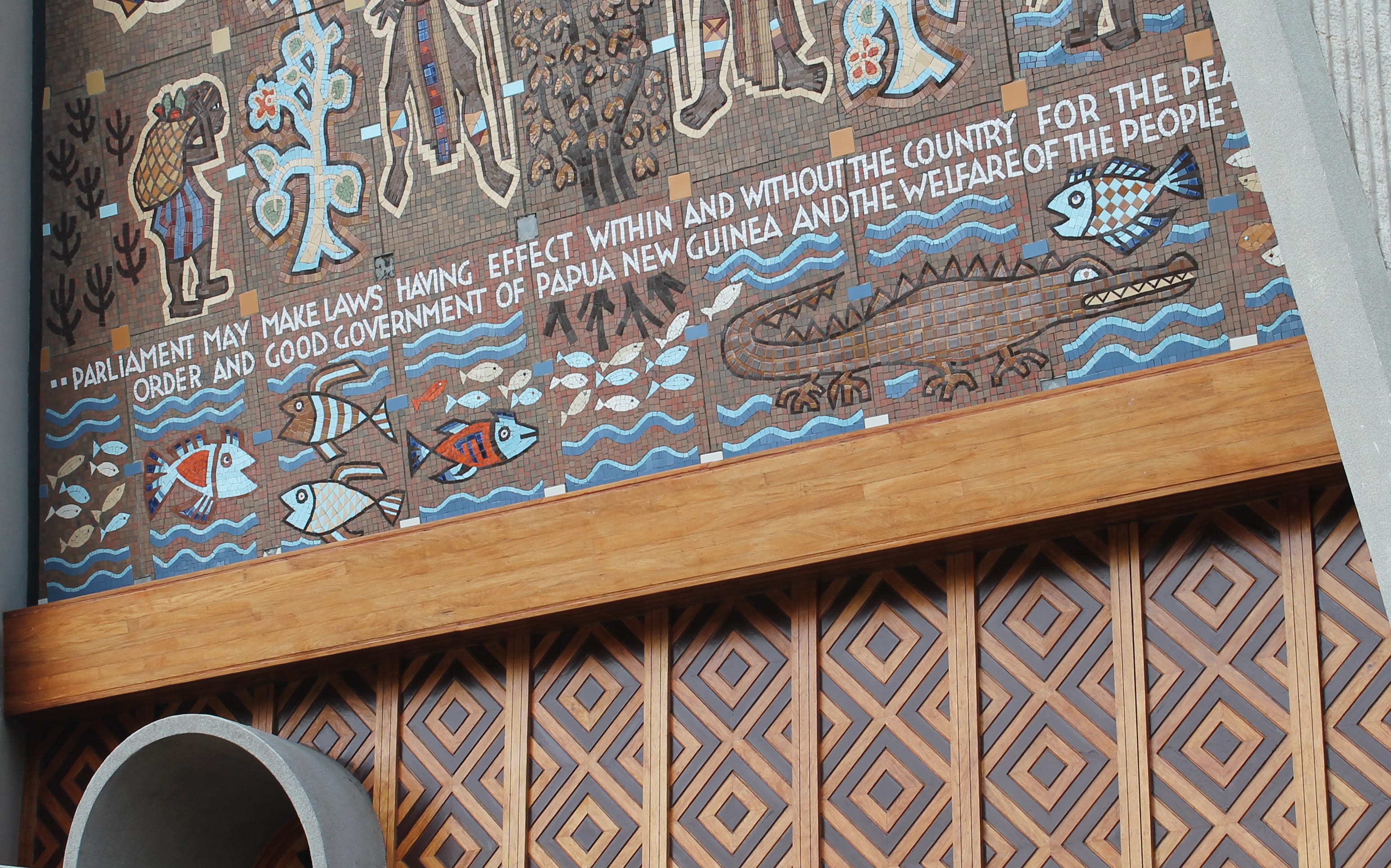 Papua New Guinea's parliament facade, after the removal of anthropomorphic carved heads from the front lintel.