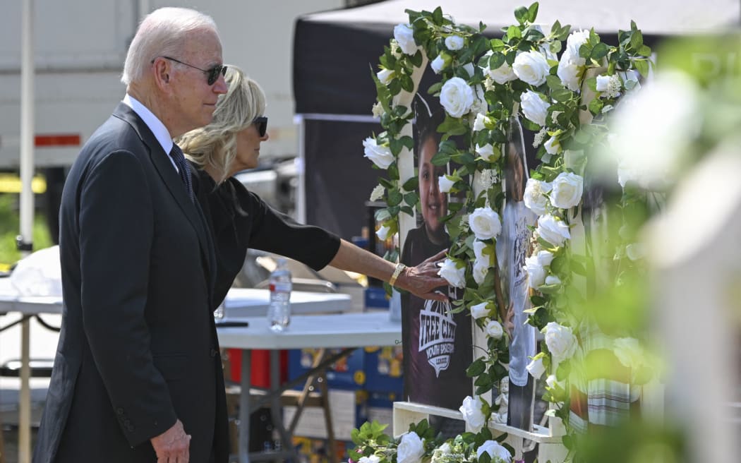 US President Joe Biden and First Lady Jill Biden pay their respects at a makeshift memorial outside of Robb Elementary School in Uvalde, Texas on 29 May 2022.