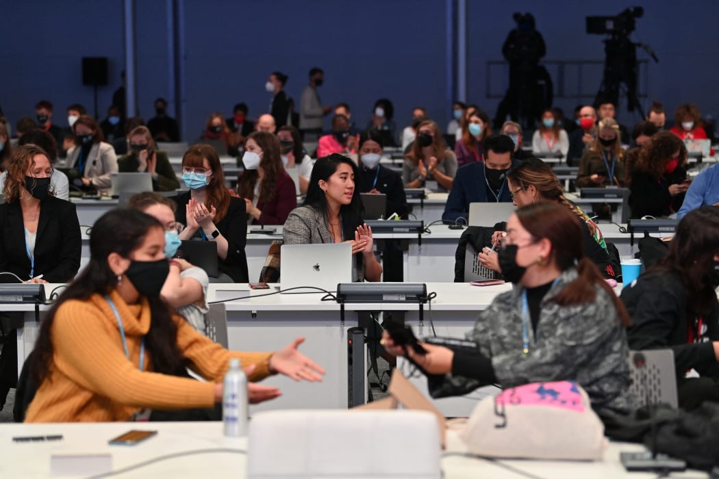 Delegates chat at the People's Plenary during the COP26 UN Climate Change Conference in Glasgow on 12 November 2021.