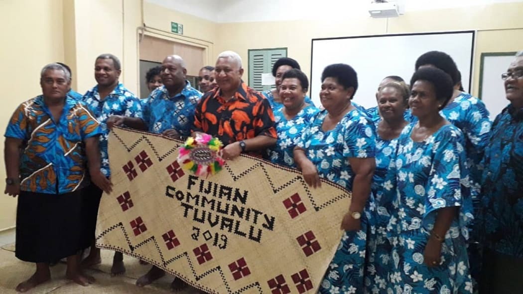Prime Minister Frank Bainimarama with members of the Fijian community in Tuvalu.