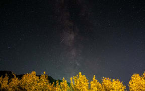 Meteors of the Orionid meteor shower streak as they cross through the Milkyway in the mountainous area of Tannourine in northern Lebanon, on October 3, 2021. (Photo by Ibrahim CHALHOUB / AFP)