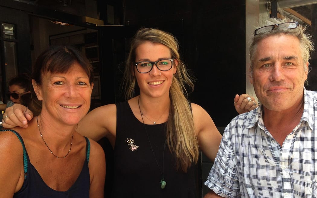 Chessie Henry (centre) with her mum, Esther, and father, Chris.