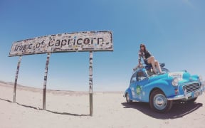 Laura Morrison and her 1958 Morris Minor 1000 which she drove from Aberdeen to Cape Town.