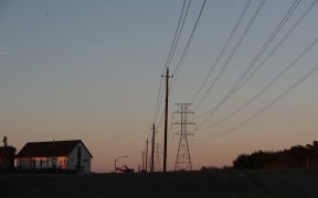 File photo. Electric power lines run through a neighborhood in Austin, Texas, 19 February.