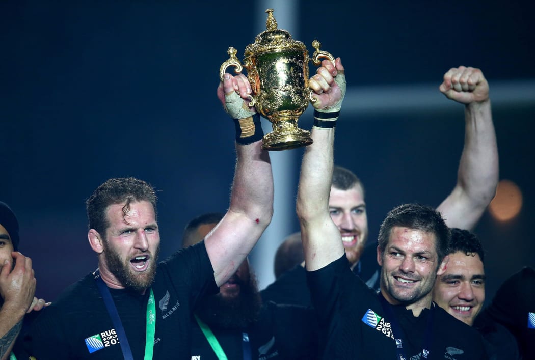 All Blacks Kieran Read, left, and Richie McCaw lift the Webb Ellis cup