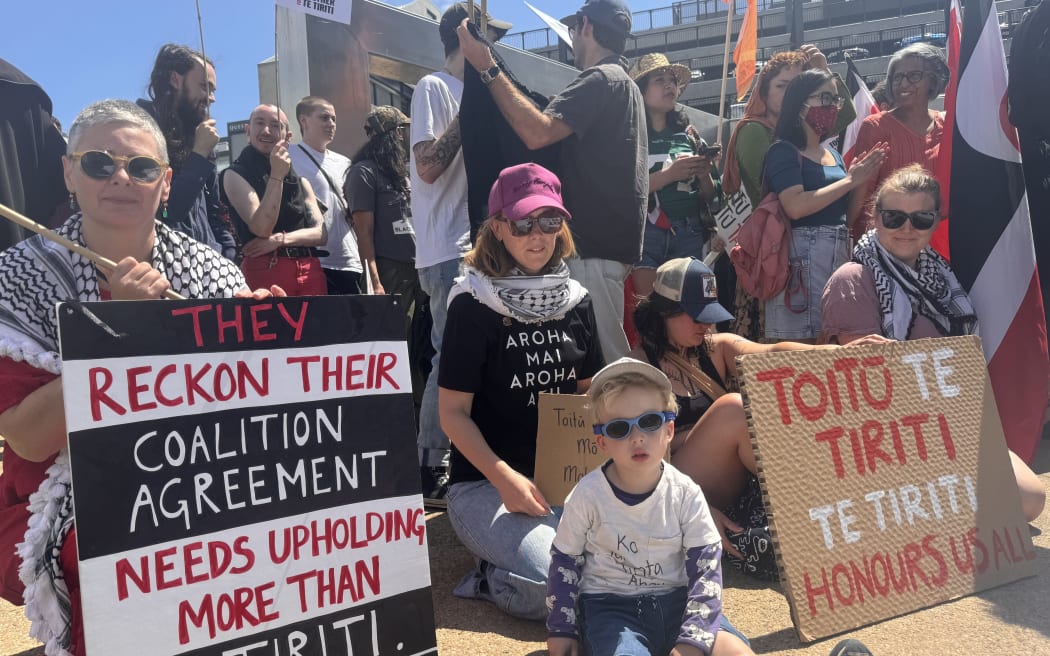 Emma and her son Griffin (pictured in the middle) stood proudly as tauiwi at the Newmarket hīkoi.