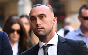 Former New Zealand international soccer player Clayton Lewis arrives at the Sydney court.