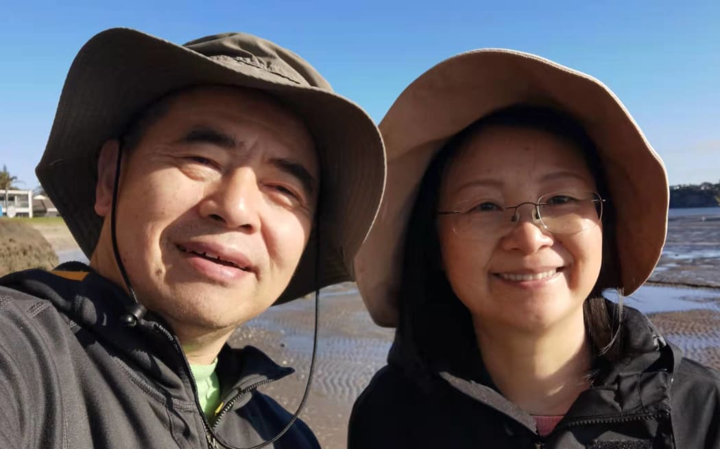 Yalin Zou and his wife, Helen Wu, pose for a selfie during a walk in Auckland.