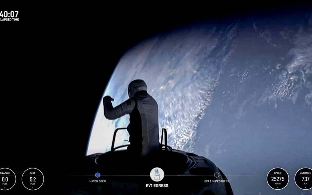 This still image taken from a SpaceX and Polaris broadcast on September 12, 2024, shows US fintech billionaire Jared Isaacman (EV1) peeking out to space from a hatch structure called "Skywalker", during the first private spacewalk performed by the crew of the SpaceX Polaris Dawn mission. After trekking deeper into space than any humans in the last half-century, a pioneering private crew is set to make history September 12, 2024, with the first-ever spacewalk by non-professional astronauts. The SpaceX Polaris Dawn mission, led by fintech billionaire Jared Isaacman, launched early Tuesday from the Kennedy Space Center in Florida, reaching a peak altitude of 870 miles (1,400 kilometers). (Photo by Polaris Program / AFP) / RESTRICTED TO EDITORIAL USE - MANDATORY CREDIT "AFP PHOTO / SpaceX / Polaris" - NO MARKETING NO ADVERTISING CAMPAIGNS - DISTRIBUTED AS A SERVICE TO CLIENTS