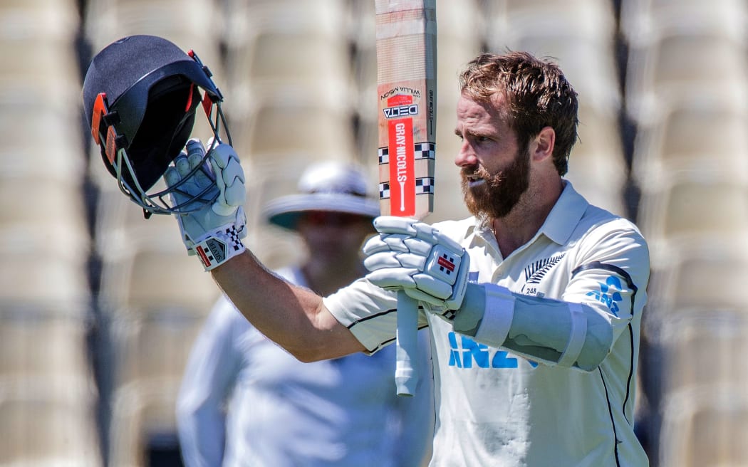 New Zealand's captain Kane Williamson celebrates reaching his double century (200 runs) during the second day of the first Test cricket match between New Zealand and West Indies at Seddon Park in Hamilton on December 4, 2020.