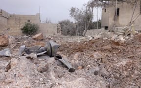 Damaged buildings are seen after Syrian regime and pro-regime terrorist groups carried out airstrike in the Russian resort city of Sochi, in Jarjanaz village of Syria