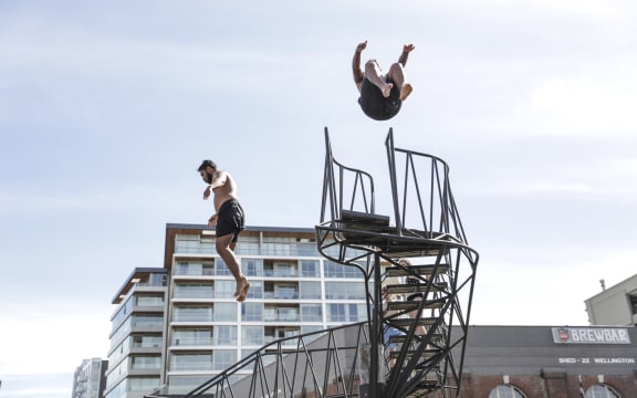 Summer in Wellington, people jump into the harbour.
