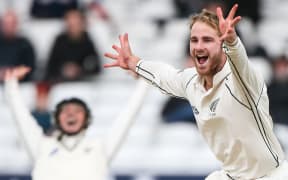 New Zealand's Kane Williamson celebrates the wicket of England's Alastair Cook.