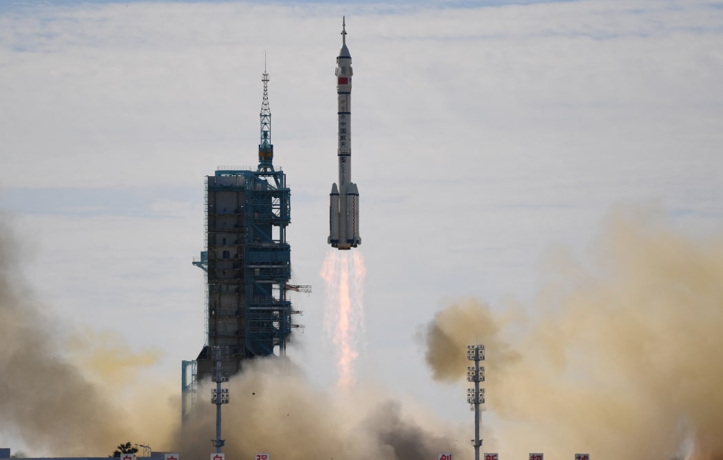 A Long March-2F carrier rocket, carrying the Shenzhou-12 spacecraft and a crew of three astronauts, lifts off from the Jiuquan Satellite Launch Centre in the Gobi desert on June 17, 2021,