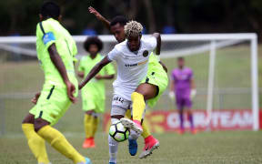Team Wellington's Nathanael Hailemariam under pressure from Magenta defenders. CREDIT: OFC / phototek /Shane Wenzlick