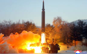 This picture taken on 5 January,2022 and released from North Korea's official Korean Central News Agency (KCNA)  shows what North Korea says is the Academy of Defence Science of the DPRK test-firing a hypersonic missile on January 5 at an unconfirmed location.