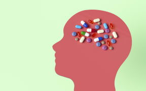 Conceptual illustration showing drugs that target the human brain to treat neurological disorders.