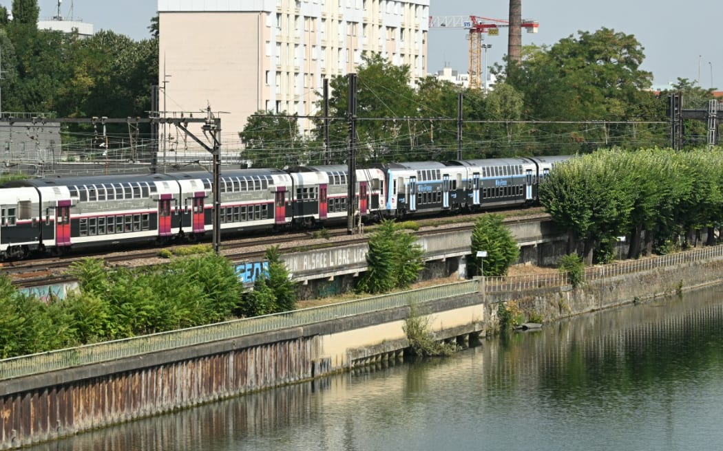 (FILES) This photograph taken in Choisy-le-Roi, on the outskirts of Paris, on 14 August, 2025 shows the Seine river where firefighters were called to pulled out four men's bodies from the river on August 13, 2025, after an alert was raised by a passenger travelling on the RER C train, who reported seeing a body floating in the Seine, according to police sources.