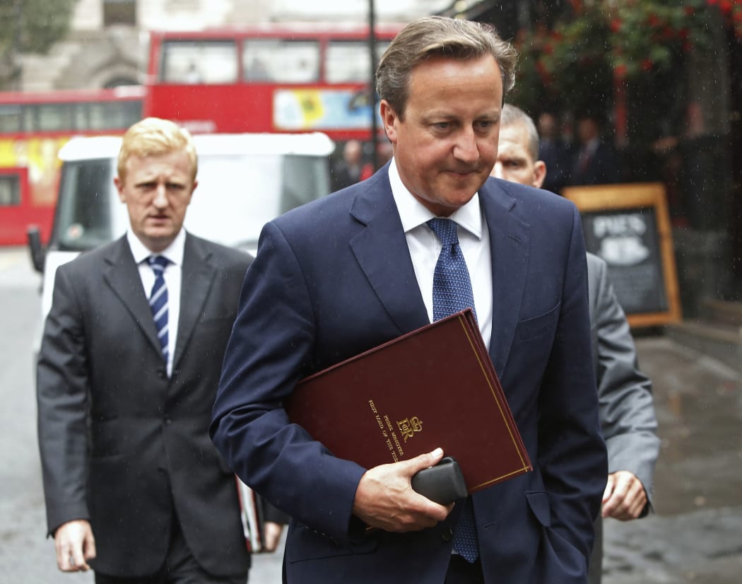 British Prime Minister David Cameron on his way to Parliament to announce new anti-terror measures.