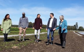 Green Party co-leaders Marama Davidson and James Shaw along with environment spokesperson Eugenie Sage being shown around by Logan Kerr and Dominique Schacherer on an organic farm in Leeston on 12 September, 2020.