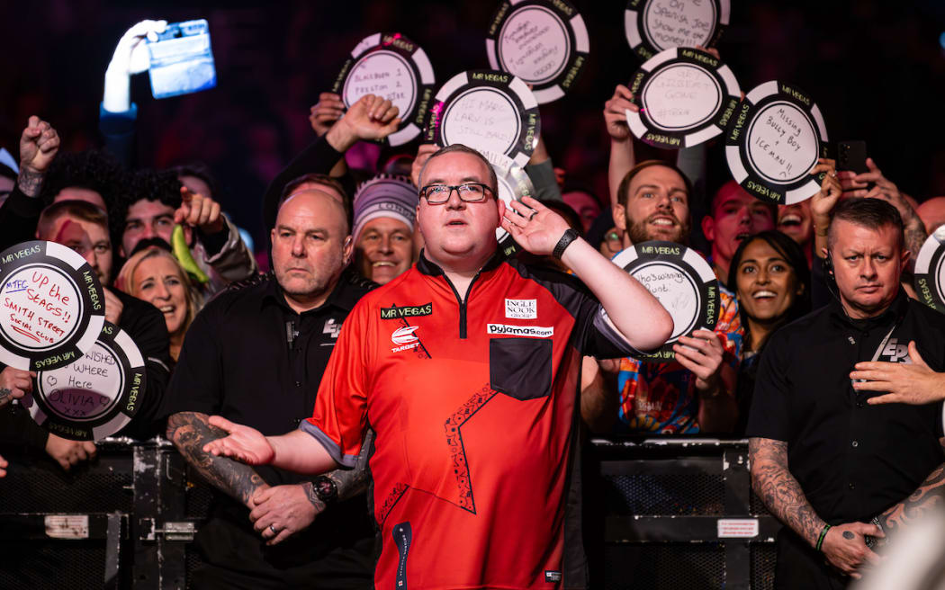 Stephen Bunting greets the fans on the walk on before the match.