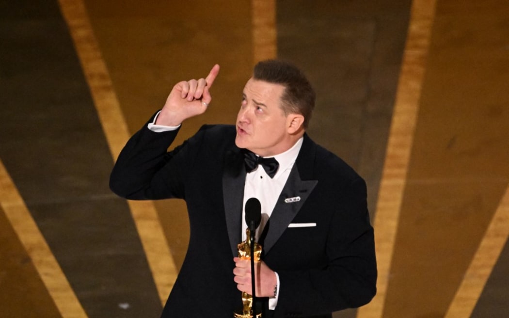 US actor Brendan Fraser accepts the Oscar for Best Actor in a Leading Role for "The Whale" onstage during the 95th Annual Academy Awards at the Dolby Theatre in Hollywood, California on March 12, 2023. (Photo by Patrick T. Fallon / AFP)
