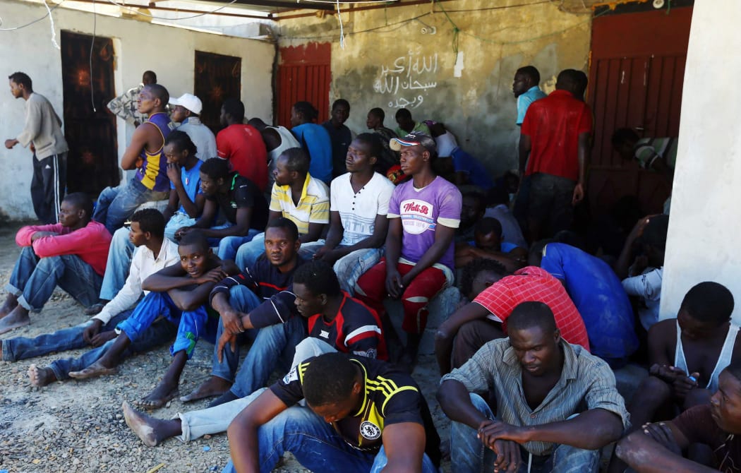 Illegal migrants rest after they were rescued by the Libyan coastguard.