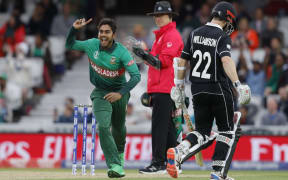 Mehidy Hasan Miraz celebrates after taking the wicket of Kane Williamson.