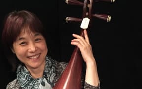 Wu Man and her pipa with a redwood belly