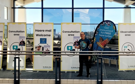 Public Health pharmacist and outreach vaccinator Christopher Leung, setting up the measles pop-up clinic at the Manukau Super Clinic.
