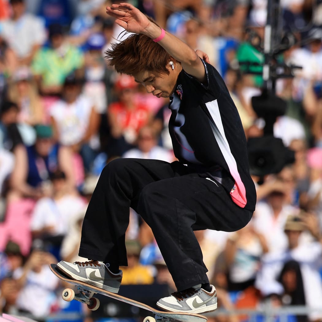 Japan's Yuto Horigome pulls off the final trick during the men's skateboarding street final.