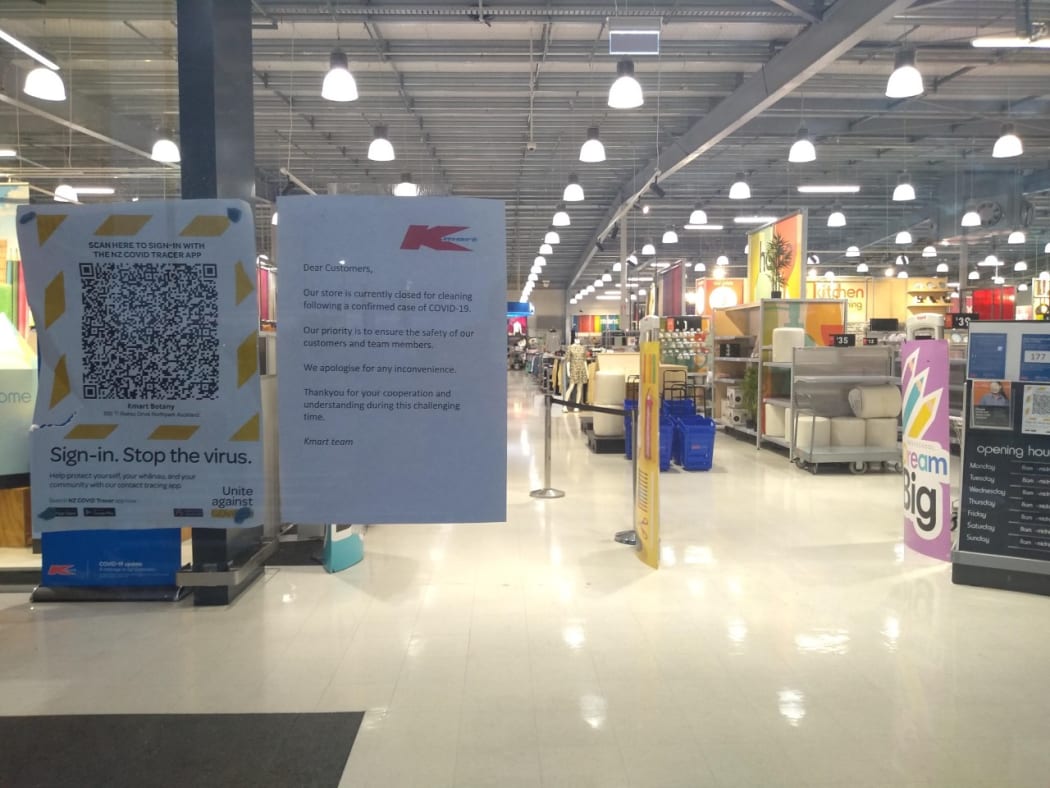 A sign on the door of Kmart Botany notifies customers the store is closed for cleaning due to a Covid-19 case.