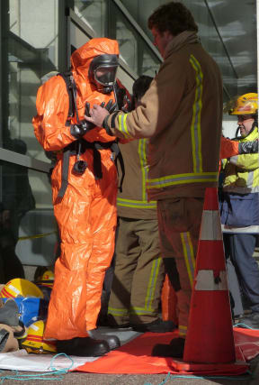 Emergency staff had to wear protective clothing.