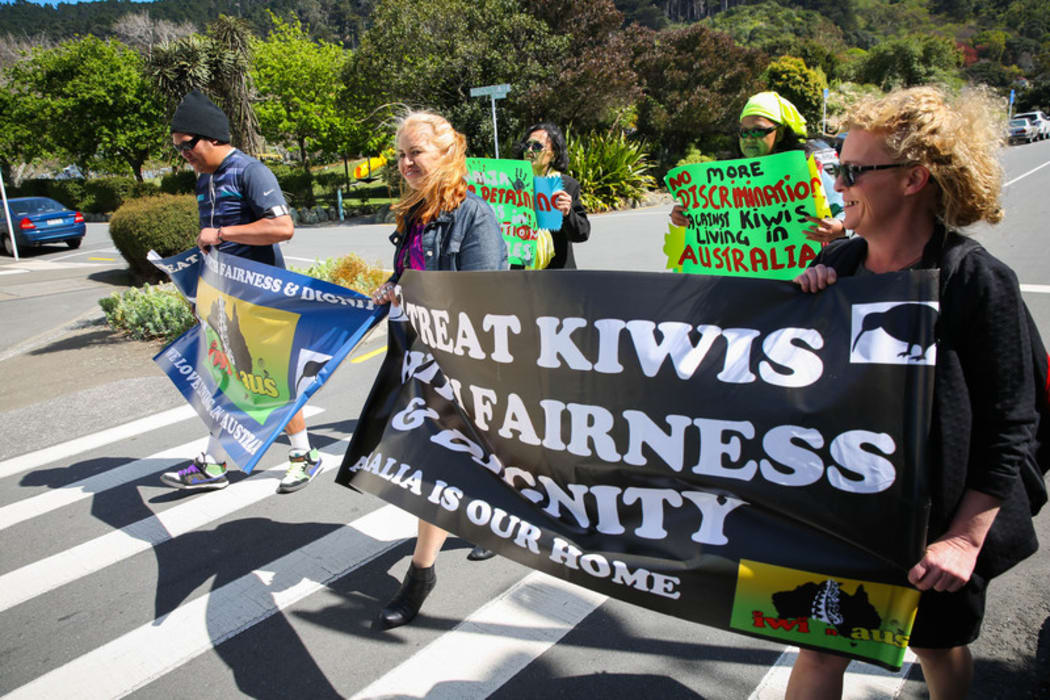Erina Morunga and protesters march from the Australian High Commission