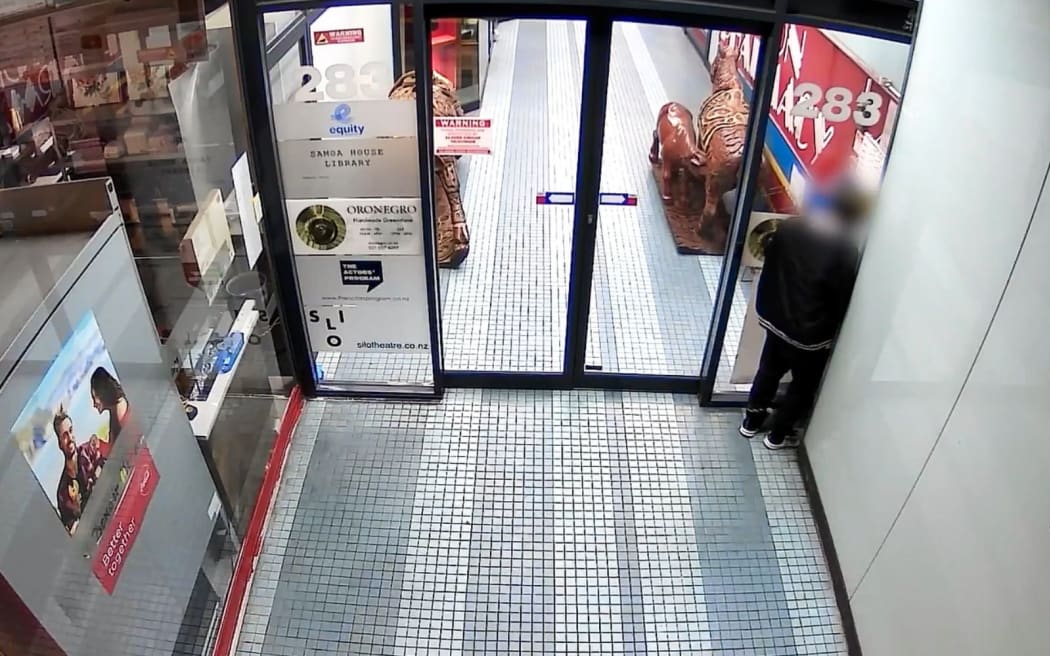 A person caught on CCTV camera taking a wee outside Orenegro on Karangahape Rd, Auckland.