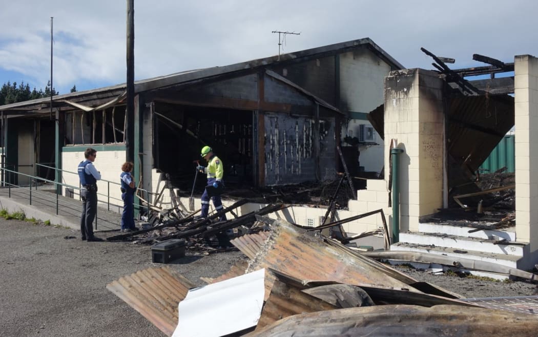 Police arrive after the early morning fire at the Christchurch Bowls Association building