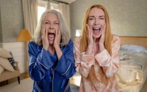 Lindsay Lohan and Jamie Lee Curtis screaming as they wake up in swapped bodies in the film Freakier Friday.