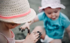 Two young children playing