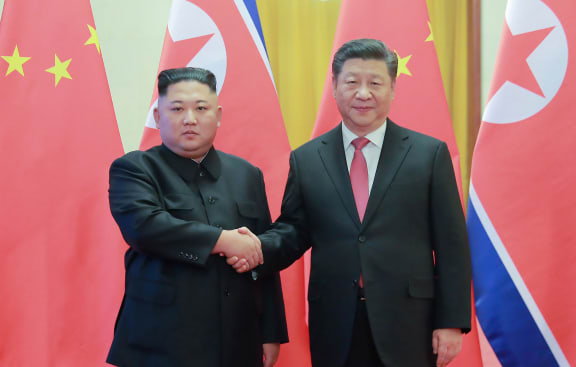 North Korea's leader Kim Jong Un (left) shaking hands with China's President Xi Jinping during a welcome ceremony at the Great Hall of the People in Beijing in January, 2019.