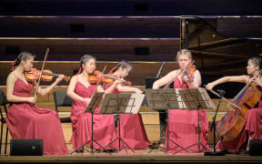 Juliusz Quintet performing on stage at Auckland Town Hall