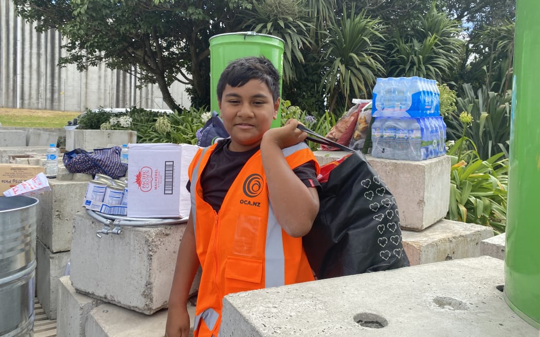 10-year-old Dempsey Taukeiaho helping with donations for the Tonga Tsunami relief effort