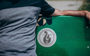 A surfboard bench in memory of tour guide Hayden Marshall-Inman whose body has not been recovered since the Whakaari White Island eruption.