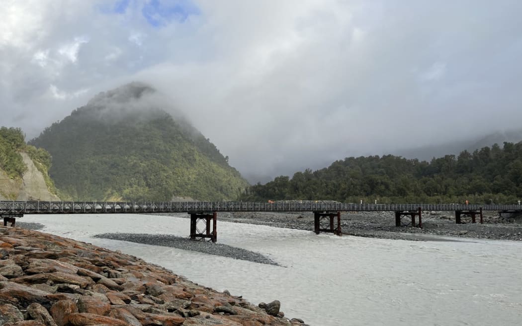 The northern bank of the Waiho River showing the current Waiho River bailey bridge.