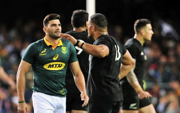 Damian de Allende of South Africa is consoled by Ofa Tu'ungafasi of New Zealand after being sent off during the 2017 Rugby Championship game at Newlands.