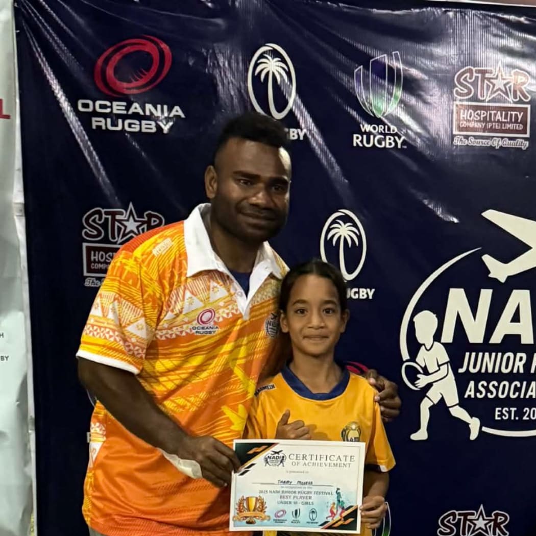 Jerry Tuwai with a Nauru player in Nadi. Photo: Nauru Rugby