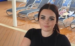 Jadeleigh, 15, wearing a black t-shirt in this photo, has brunette hair.