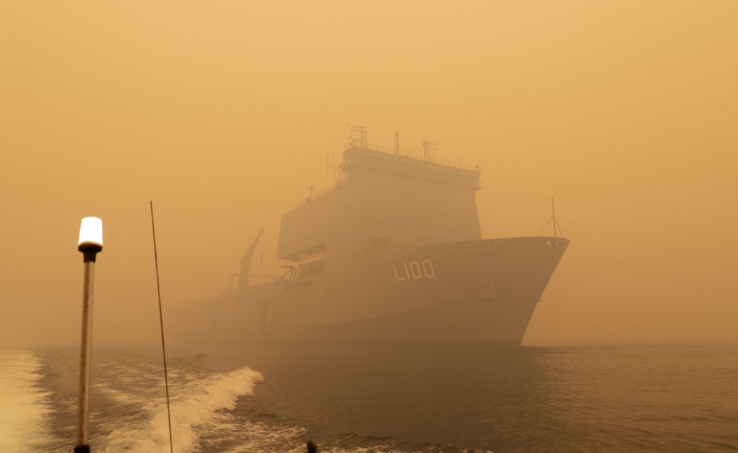 HMAS Choules sailing off the coast of Mallacoota, Victoria, to assist in bushfire relief efforts  on January 2, 2020.